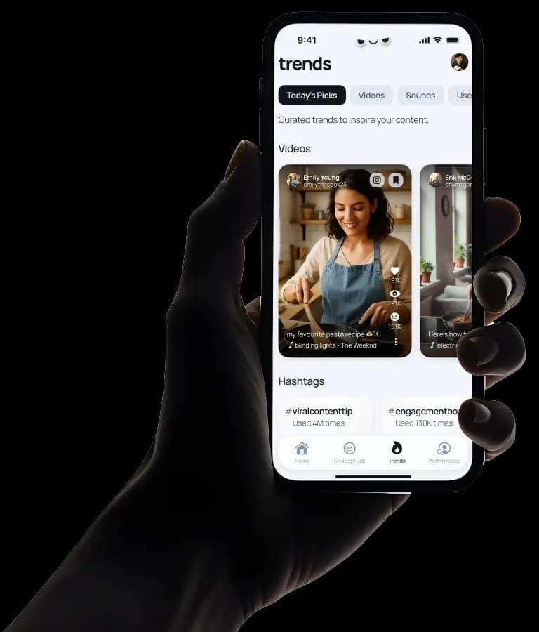 Hand holding phone showing trending content